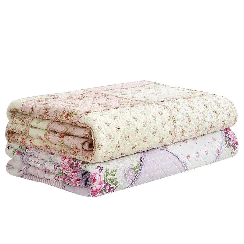 Floral Print Cotton Quilt Bedspread on The Bed